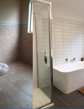 Tiled bathroom with freestanding back to wall bath